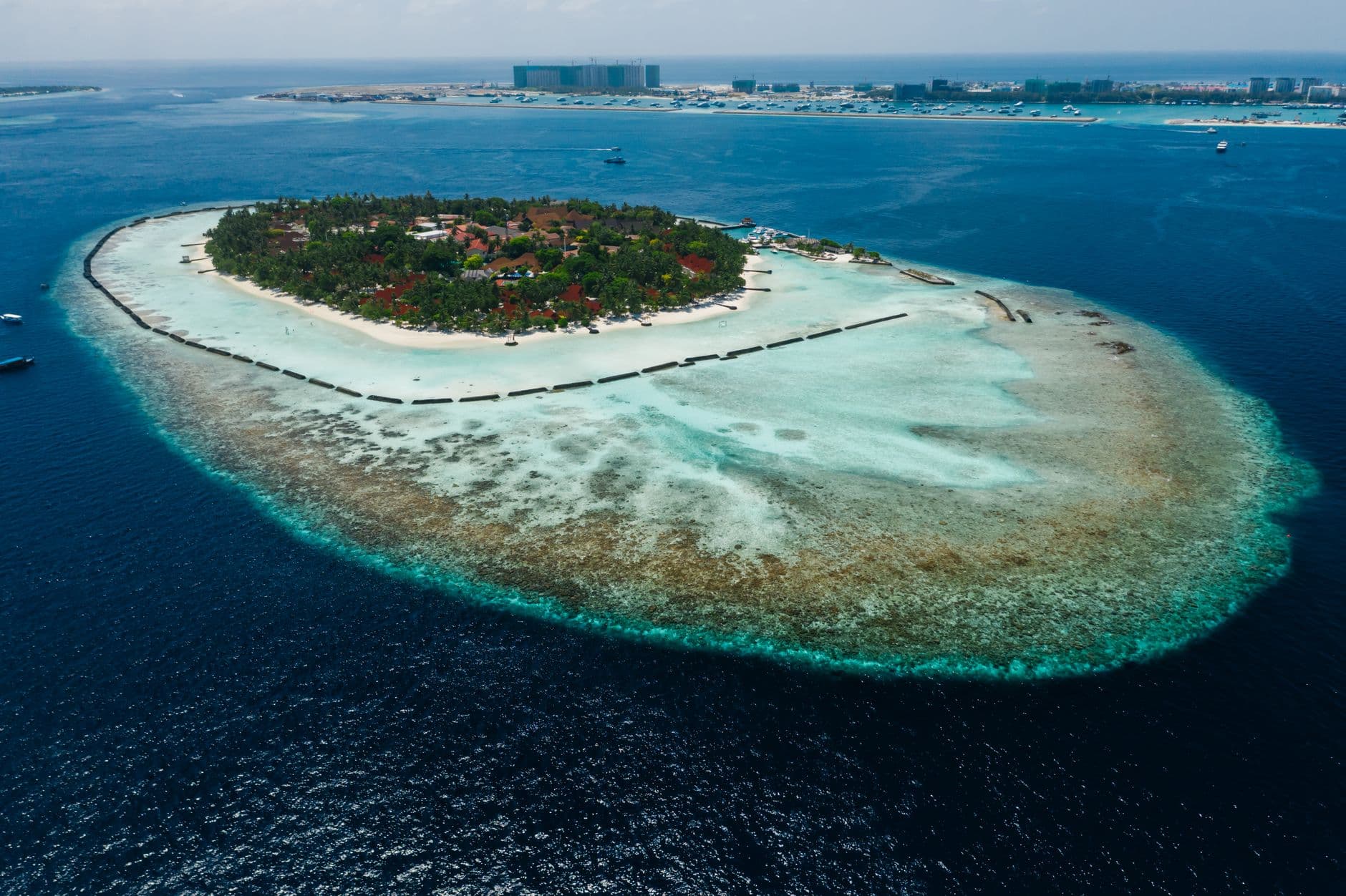 White-sand beach and turquoise lagoon on a Maldivian resort island