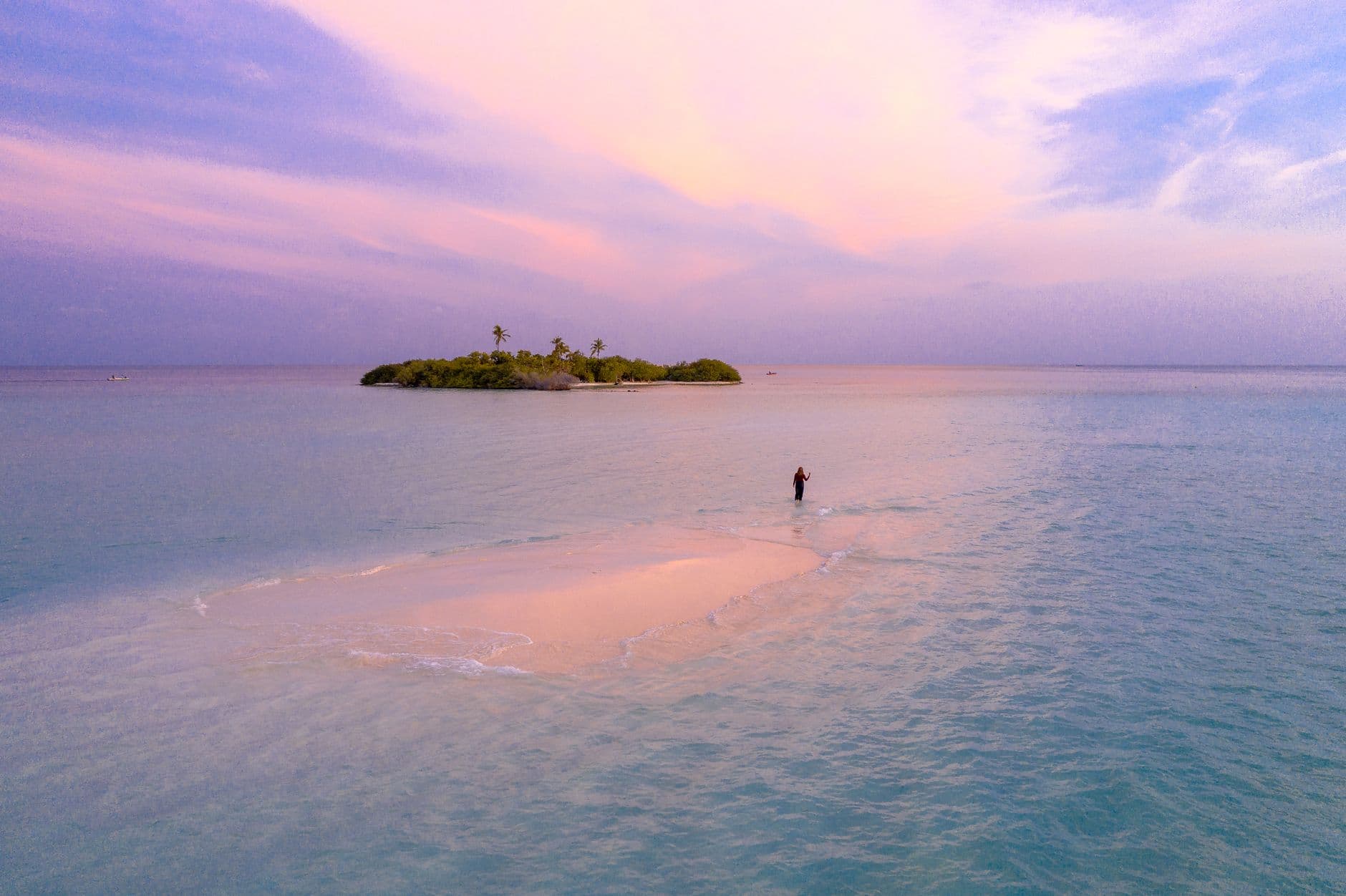 Sandbank surrounded by clear turquoise water in the Maldives